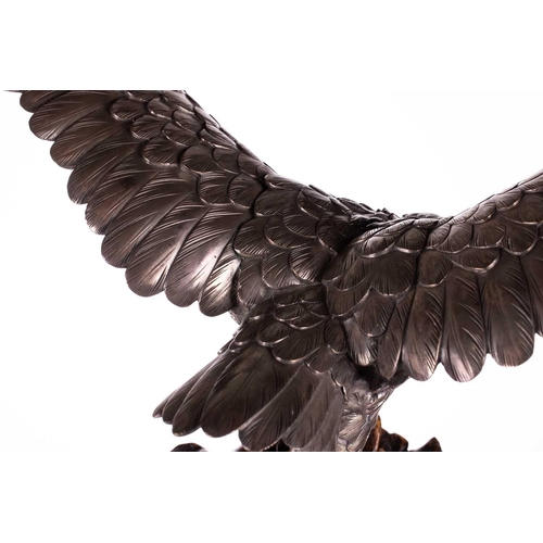 235 - Genryusai Seiya; a Japanese silvered bronze okimono of a sea eagle, Meiji period late 19th century, ... 