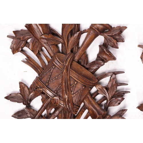 236 - A pair of 20th-century Louis XVI style, wood effect composition wall appliques, each with tied ribbo... 