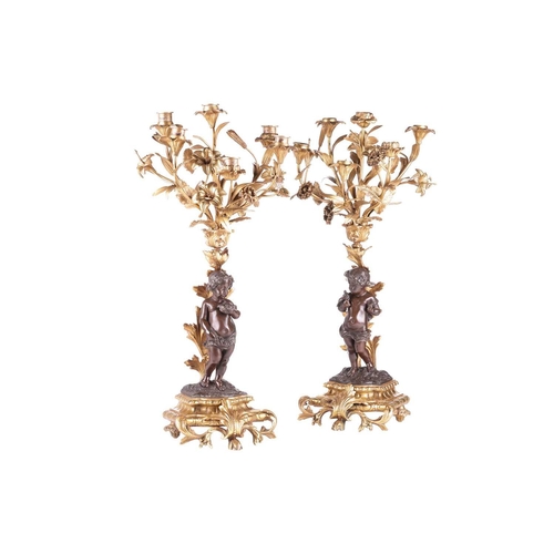 239 - A pair of French ormolu and bronze figural six-sconce candelabra in the manner of Auguste Moreau a p... 