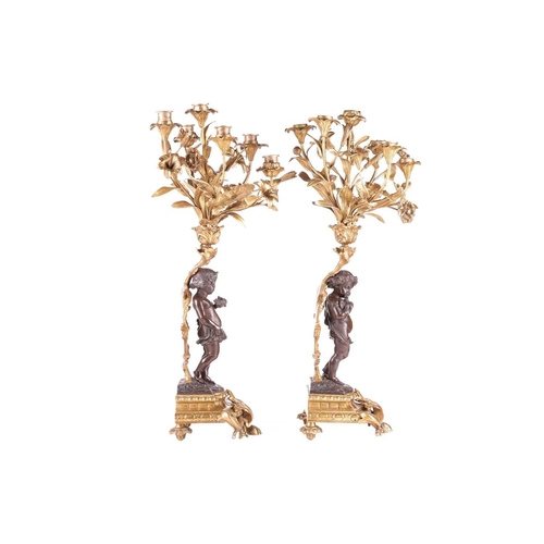 239 - A pair of French ormolu and bronze figural six-sconce candelabra in the manner of Auguste Moreau a p... 