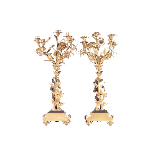 239 - A pair of French ormolu and bronze figural six-sconce candelabra in the manner of Auguste Moreau a p... 