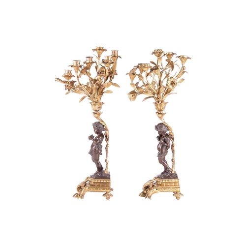 239 - A pair of French ormolu and bronze figural six-sconce candelabra in the manner of Auguste Moreau a p... 