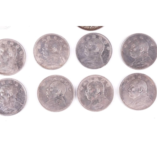 27 - A collection of eight Chinese silver 1914, one dollar (Fat-Man) coins, 4 cm diameter, together with ... 