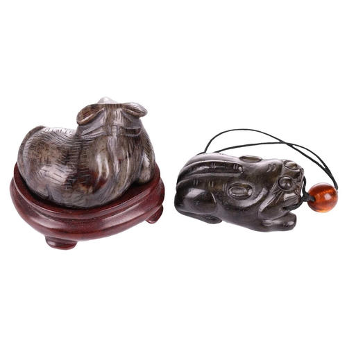 28 - A Chinese dark green jade toggle in the form of a corpulent tiger thought to be Tang Dynasty, (618 A... 