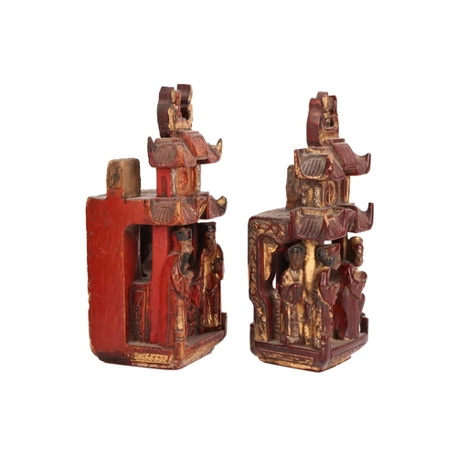 35 - A large pair of Chinese red lacquered and parcel-gilt wood architectural Dog of Foo finials, probabl... 