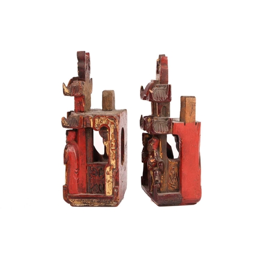 35 - A large pair of Chinese red lacquered and parcel-gilt wood architectural Dog of Foo finials, probabl... 