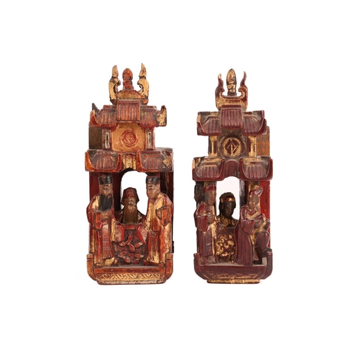 35 - A large pair of Chinese red lacquered and parcel-gilt wood architectural Dog of Foo finials, probabl... 