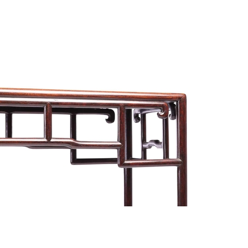 36 - A small Chinese rosewood altar/console table, early 20th century, with a cylindrical openwork base w... 