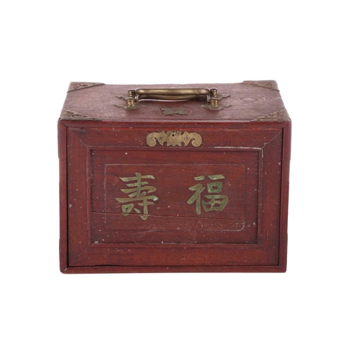 42 - A Chinese rosewood-cased mahjong set with bone and bamboo tiles the sliding door bearing the word Ma... 