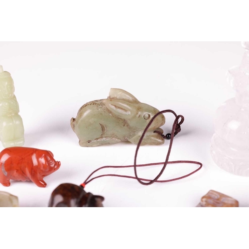 47 - A small collection of Chinese carved jade items including a celadon jade archer's ring, a small red ... 