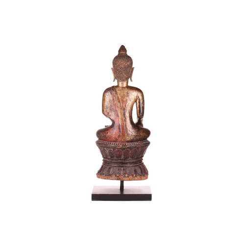 54 - A Siamese carved and giltwood, seated Buddha in Bhumisparsha, 18th century, with flame ushnisha, wit... 