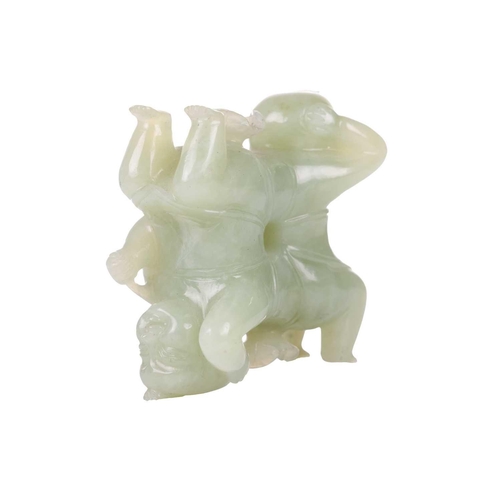 57 - A large Chinese green jade carving of two laughing Buddhai, each figure supported on the back of his... 