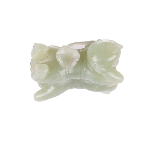 57 - A large Chinese green jade carving of two laughing Buddhai, each figure supported on the back of his... 