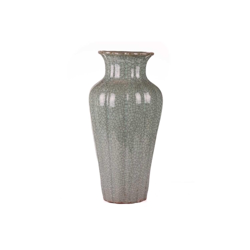 67 - A large Korean celadon green crackle glazed baluster vase, early 20th century, with a fluted body an... 