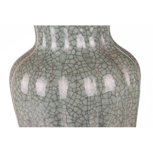 67 - A large Korean celadon green crackle glazed baluster vase, early 20th century, with a fluted body an... 