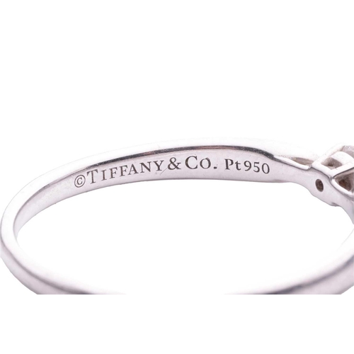 103 - Tiffany & Co. - a diamond solitaire ring in platinum, centred with a round brilliant-cut diamond of ... 