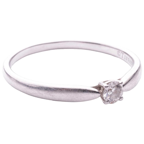 103 - Tiffany & Co. - a diamond solitaire ring in platinum, centred with a round brilliant-cut diamond of ... 