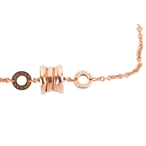 107 - Bulgari - a B.Zero 1 link bracelet, consisting of a cable link and a sprung spiral charm, flanked by... 