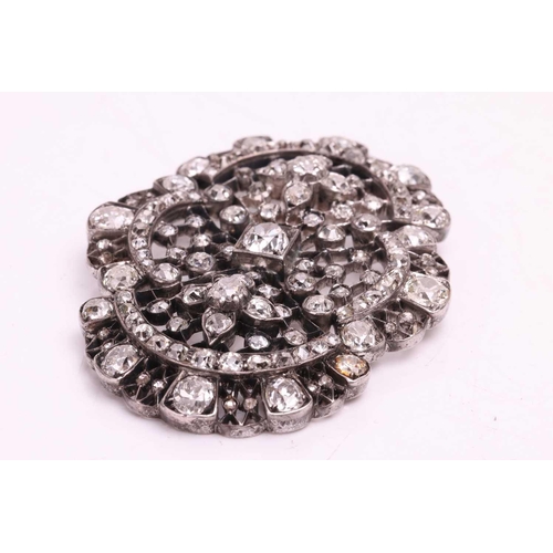 11 - A Victorian diamond brooch, set with an array of old cut and rose cut diamonds, with a total estimat... 