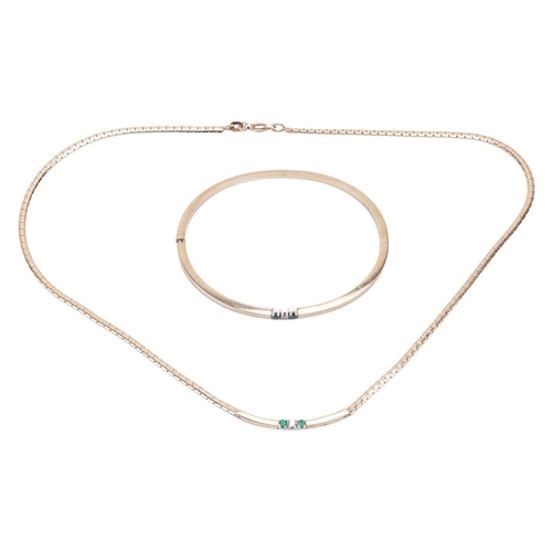 112 - An emerald and diamond-set necklace and matching bangle, each set with a round brilliant diamond fla... 