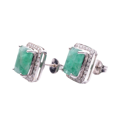 114 - A pair of emerald and diamond cluster earrings, each consisting of an octagonal step-cut emerald app... 