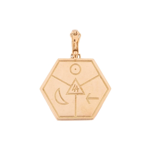 115 - A gem-set hexagonal zodiac pendant, divided into three sections with raised zodiac signs of Gemini a... 