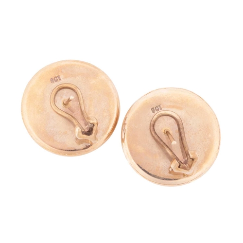 118 - A pair of domed stud earrings, of circular shape with stepped and ridged borders, fitted with ear po... 