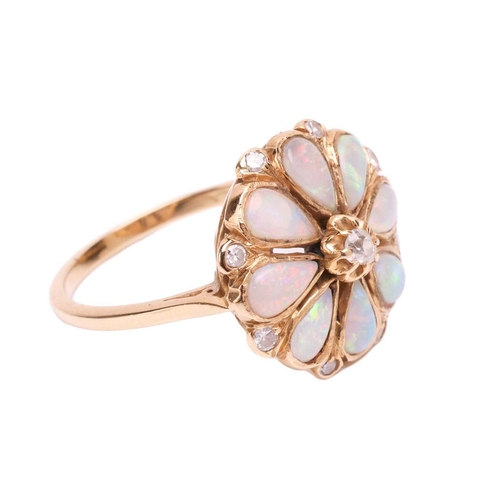 12 - An opal and diamond floral cluster ring, comprising eight pear-shaped precious opal cabochons formin... 