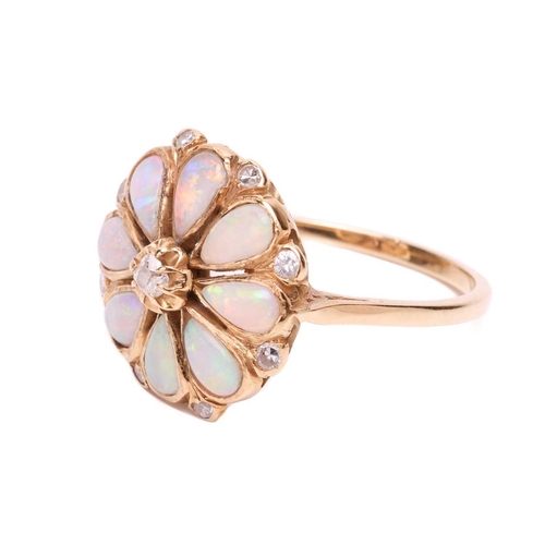 12 - An opal and diamond floral cluster ring, comprising eight pear-shaped precious opal cabochons formin... 