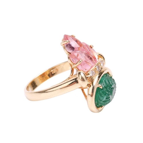 122 - An emerald, tourmaline and diamond dress ring, featuring an oval carved emerald within a collet unde... 