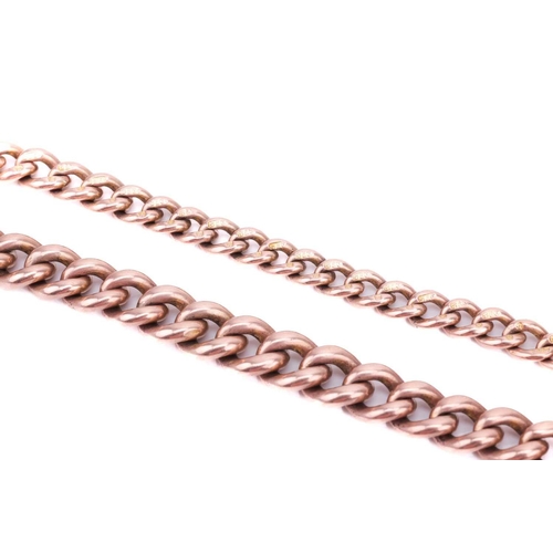 123 - A watch chain in 9ct rose gold, comprising a series of curb links terminated with swivel clasps, all... 