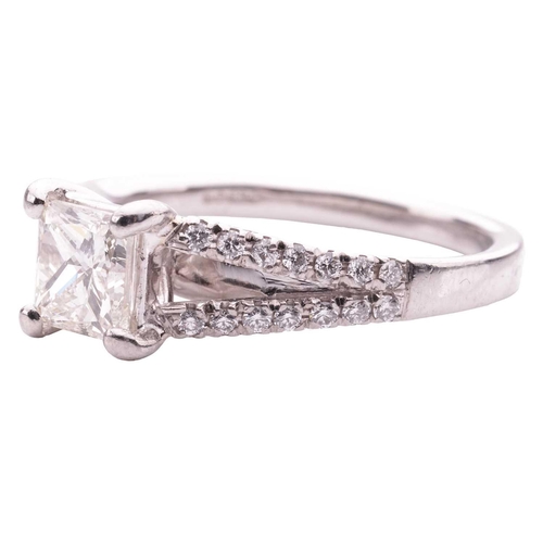 124 - A princess cut diamond ring, featuring a central princess cut diamond with an estimated weight of 0.... 