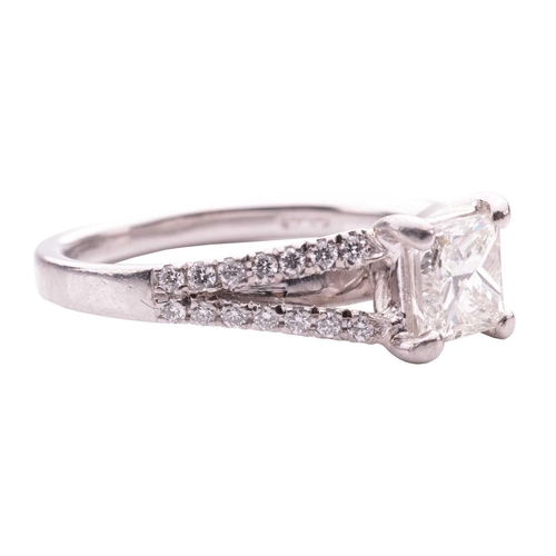 124 - A princess cut diamond ring, featuring a central princess cut diamond with an estimated weight of 0.... 