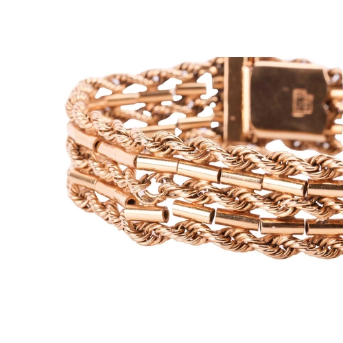 142 - A textured chain bracelet, comprised of five alternating rows of connected rope and bar link chains,... 