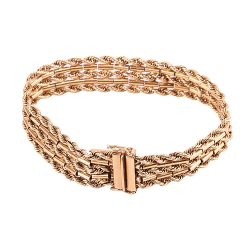 142 - A textured chain bracelet, comprised of five alternating rows of connected rope and bar link chains,... 