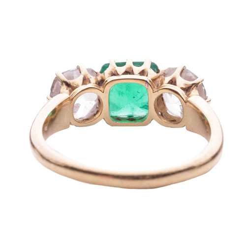 152 - An emerald and diamond three stone ring, the central square cut emerald measuring 7.1 x 7.1 x 4.5mm,... 