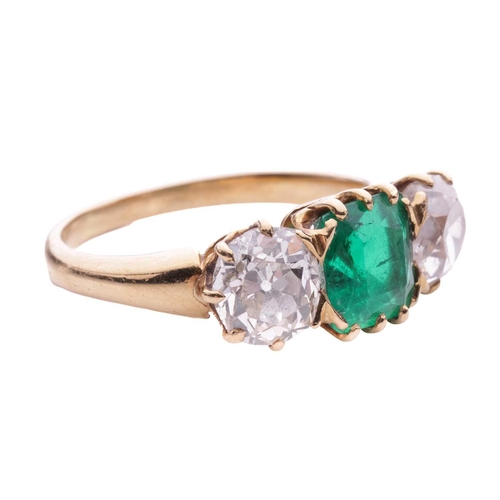 152 - An emerald and diamond three stone ring, the central square cut emerald measuring 7.1 x 7.1 x 4.5mm,... 