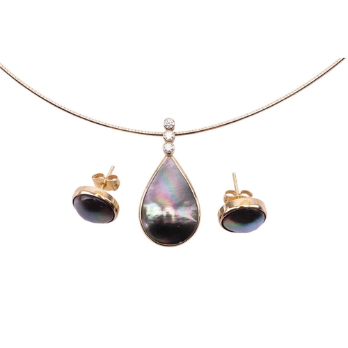 153 - A Tahitian mabé pearl necklace and earrings set; the pendant features a teardrop-shaped mabé pearl d... 