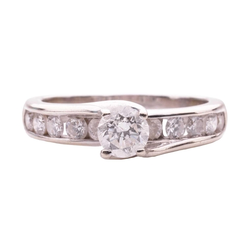 159 - A diamond solitaire ring, the central round brilliant diamond measuring approximately 4.85mm, with a... 