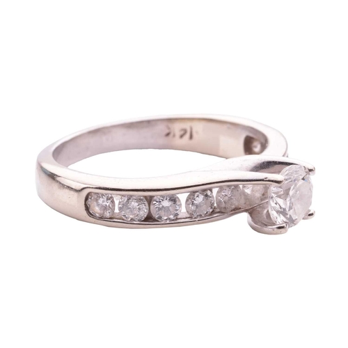 159 - A diamond solitaire ring, the central round brilliant diamond measuring approximately 4.85mm, with a... 