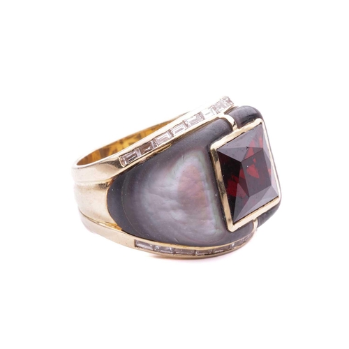 16 - A gem-set cocktail ring, centred with a square scissors-cut garnet in collet, shoulders inlaid with ... 