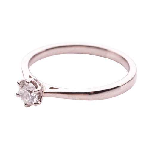 161 - A diamond solitaire ring in 18ct white gold, claw-set with a round brilliant-cut diamond of 0.30ct, ... 