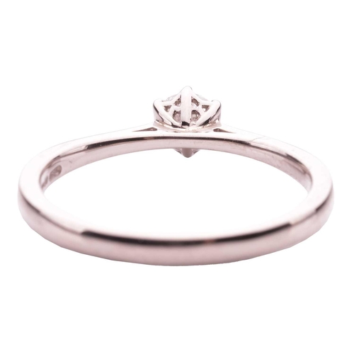 161 - A diamond solitaire ring in 18ct white gold, claw-set with a round brilliant-cut diamond of 0.30ct, ... 