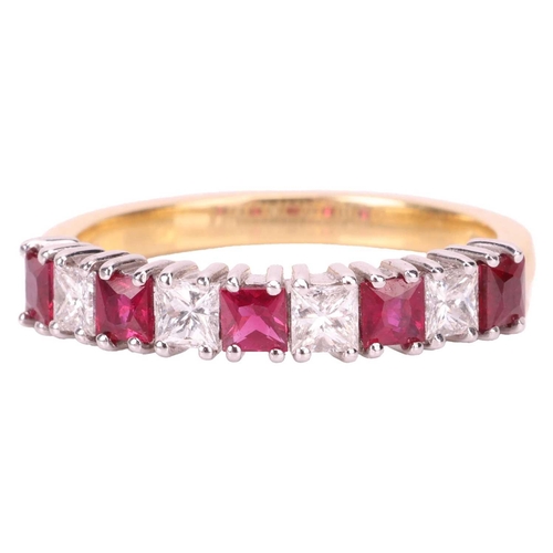 163 - A ruby and diamond half-eternity ring in 18ct gold, comprising princess-cut rubies with an estimated... 