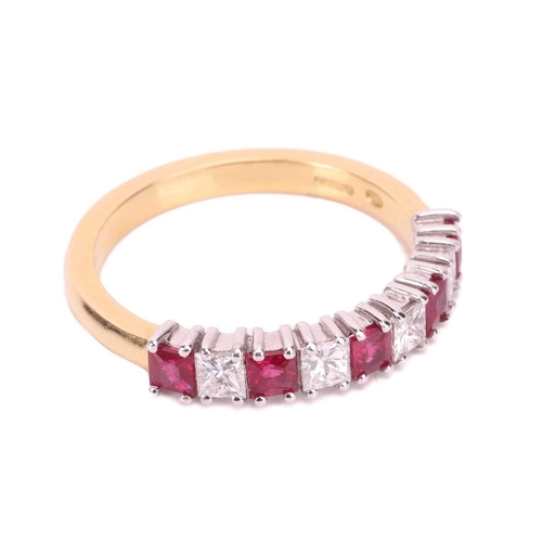 163 - A ruby and diamond half-eternity ring in 18ct gold, comprising princess-cut rubies with an estimated... 