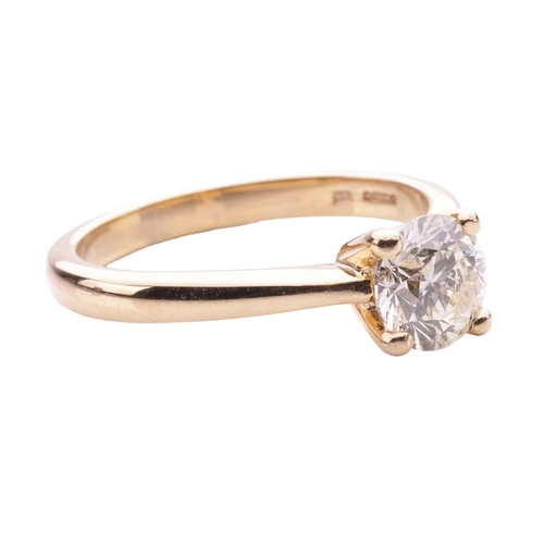 166 - A diamond solitaire ring in 18ct yellow gold, claw-set with a round brilliant-cut diamond of 6.4 mm,... 