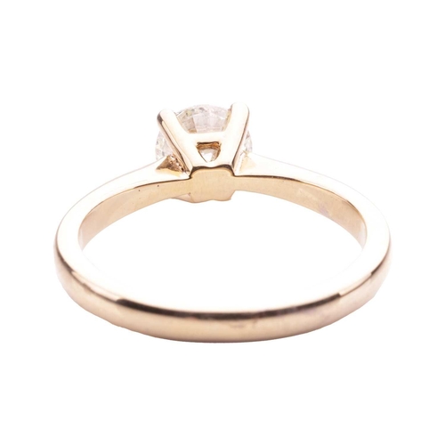 166 - A diamond solitaire ring in 18ct yellow gold, claw-set with a round brilliant-cut diamond of 6.4 mm,... 