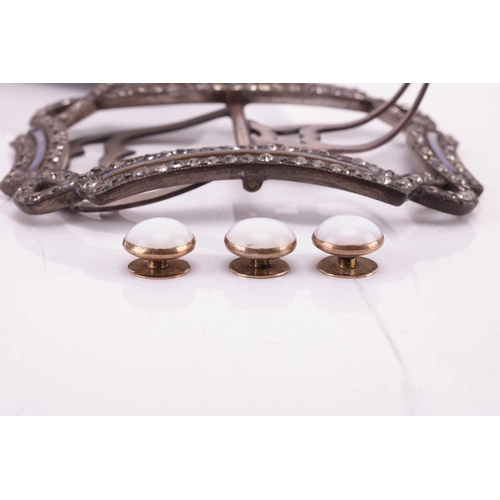 169 - A Victorian buckle and a set of dress studs; the buckle designed as a continuous ribbon set with pas... 