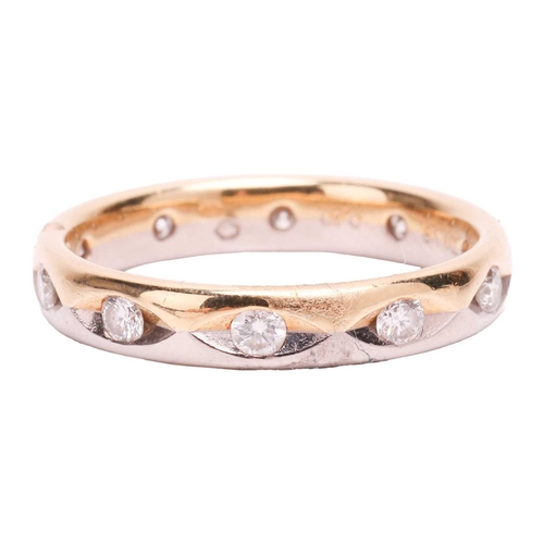 18 - A diamond wedding band in 18ct bi-coloured gold, set with ten brilliant-cut diamonds with an estimat... 