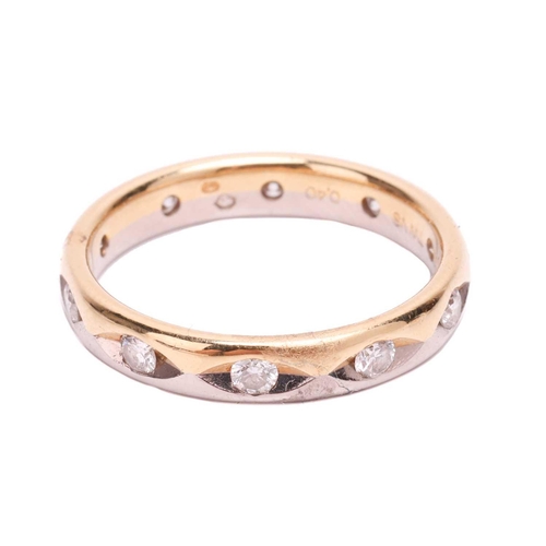 18 - A diamond wedding band in 18ct bi-coloured gold, set with ten brilliant-cut diamonds with an estimat... 